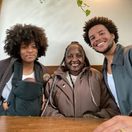 rlene Mowry took a picture with her son, daughter-in-law, and grandchild.